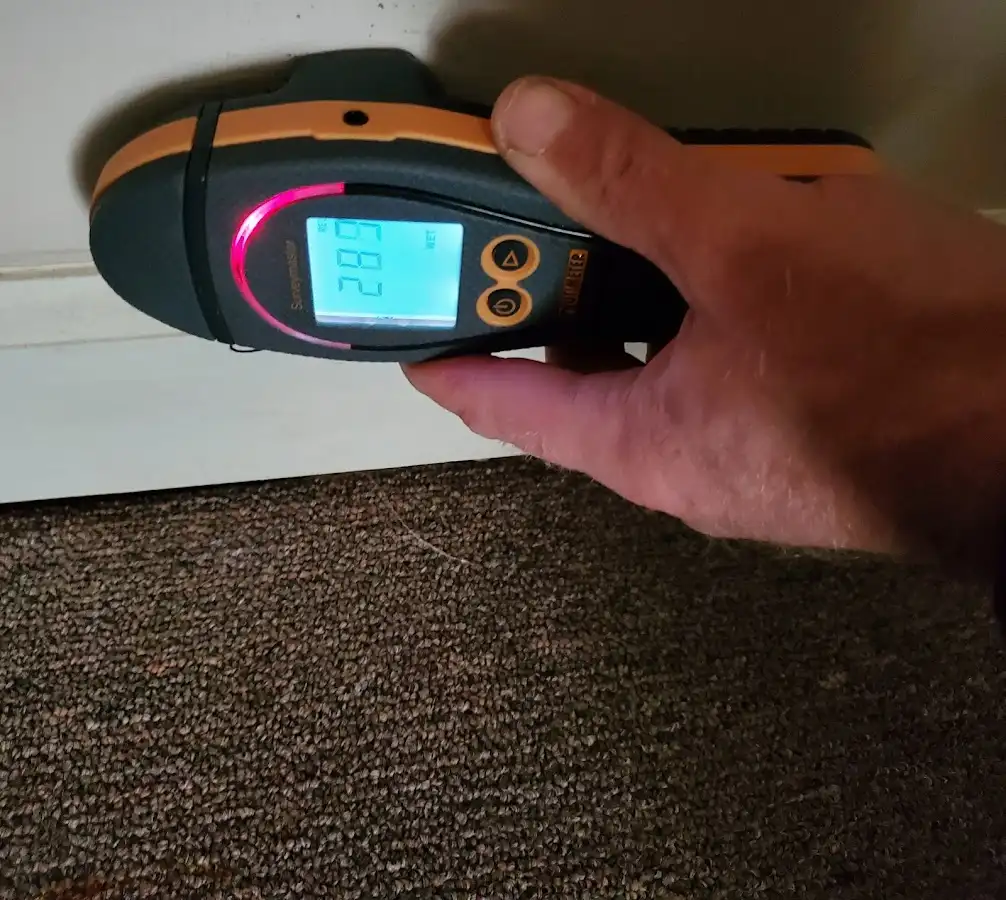 Moisture detection at baseboard during Storm Damage Restoration in Jefferson City